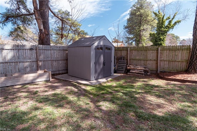 view of shed featuring a fenced backyard