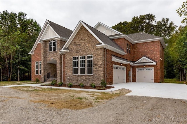 craftsman inspired home with brick siding, a shingled roof, concrete driveway, a garage, and stone siding