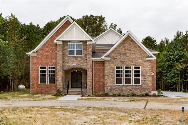 craftsman inspired home featuring stone siding