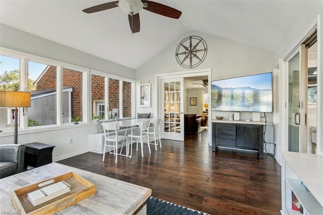 living area featuring hardwood / wood-style flooring, a ceiling fan, and vaulted ceiling