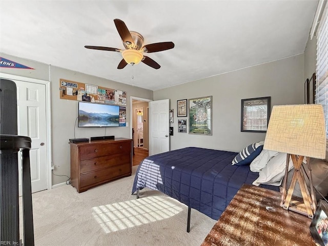 carpeted bedroom with ceiling fan