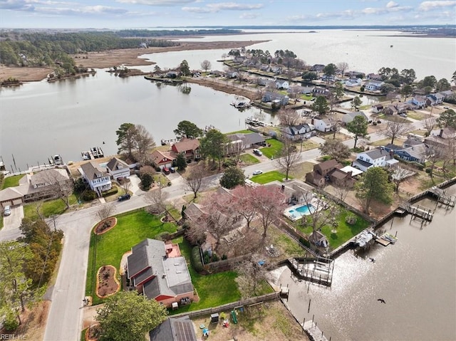 bird's eye view with a water view and a residential view