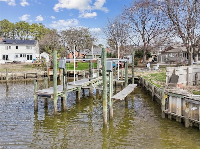 view of dock with a water view and boat lift