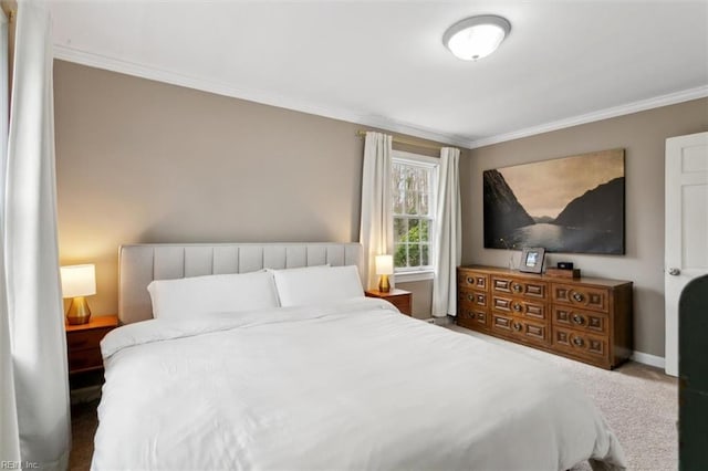 bedroom featuring crown molding, carpet, and baseboards