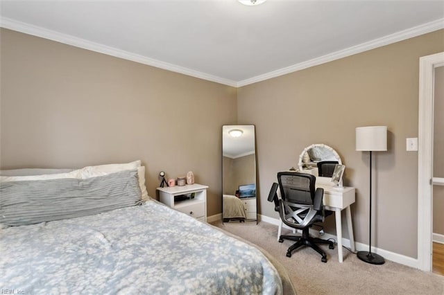 bedroom with ornamental molding, baseboards, and carpet floors