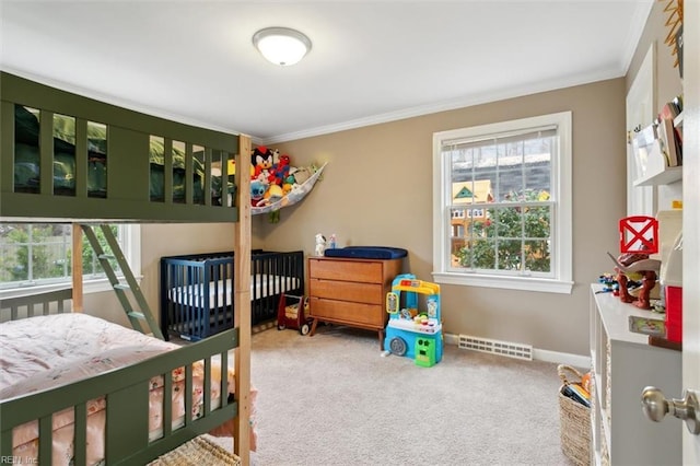 bedroom with crown molding, carpet, visible vents, and baseboards