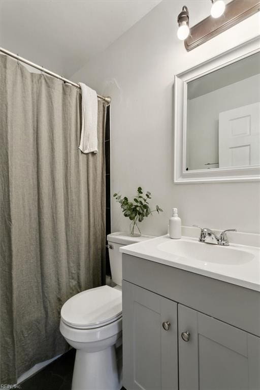 full bathroom with toilet, vanity, and a shower with curtain