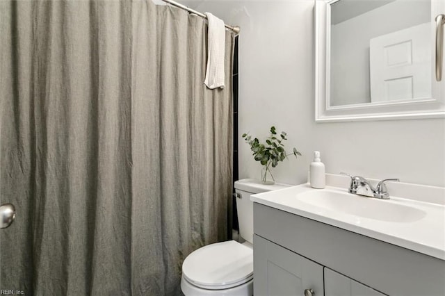 bathroom with toilet and vanity