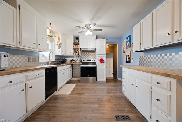 kitchen with visible vents, electric range, a sink, under cabinet range hood, and dishwasher