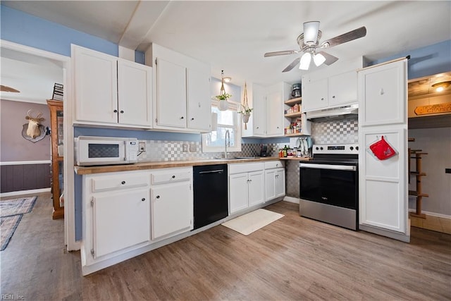 kitchen with white microwave, open shelves, stainless steel electric range, white cabinets, and black dishwasher