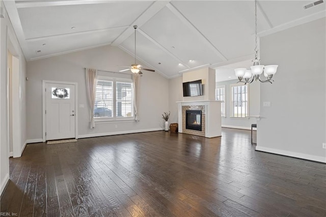 unfurnished living room featuring a glass covered fireplace, plenty of natural light, wood finished floors, and visible vents