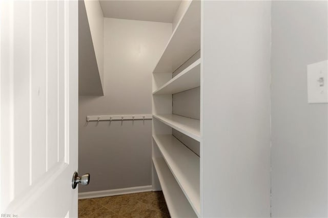 spacious closet featuring tile patterned floors