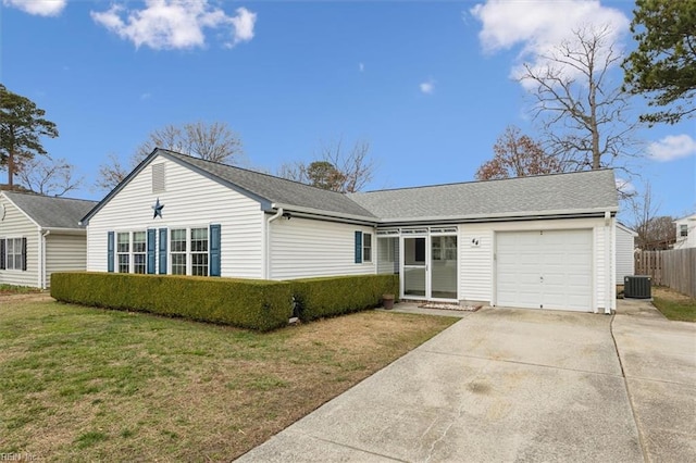 ranch-style home with a front lawn, fence, concrete driveway, central AC, and a garage