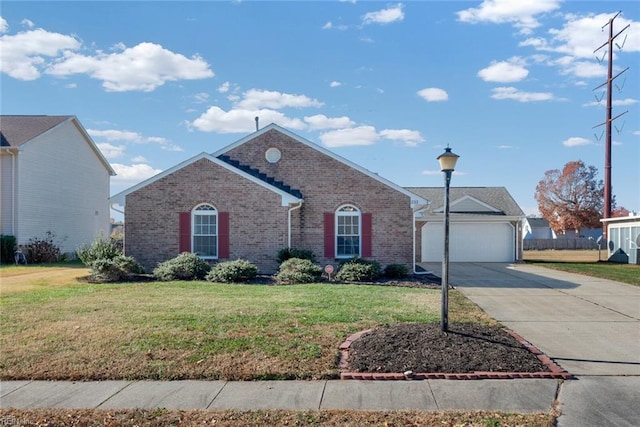 ranch-style home with an outbuilding, concrete driveway, a front yard, a garage, and brick siding