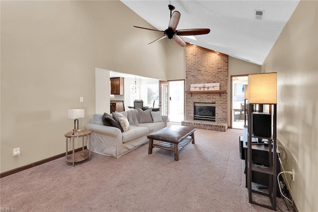 carpeted living area featuring a ceiling fan, visible vents, baseboards, high vaulted ceiling, and a fireplace