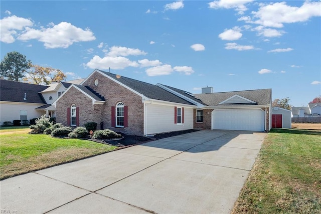 single story home with driveway, brick siding, an attached garage, and a front yard