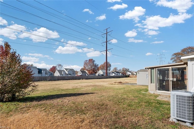 view of yard with central AC