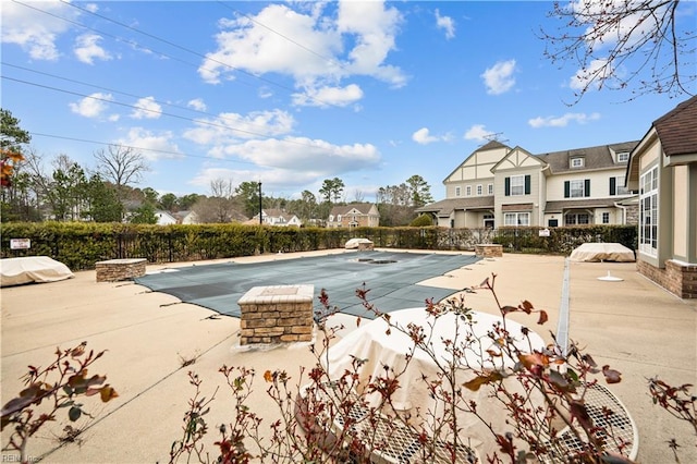 view of swimming pool with a fenced in pool, a patio, and fence