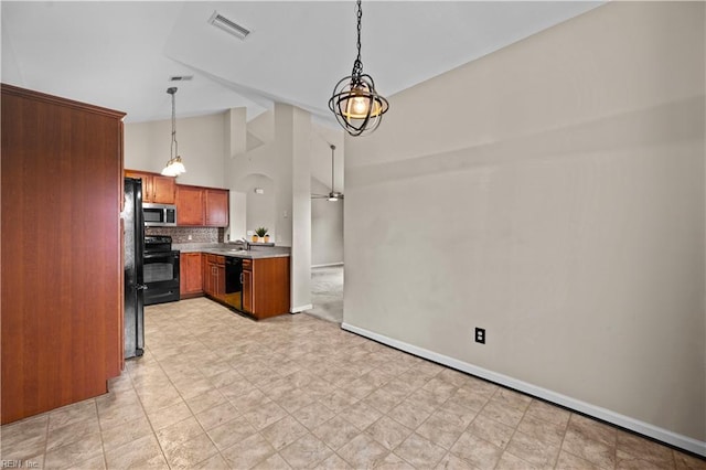 kitchen featuring visible vents, stove, dishwasher, stainless steel microwave, and backsplash