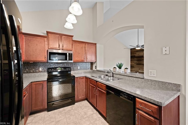 kitchen featuring high vaulted ceiling, black appliances, a ceiling fan, a sink, and tasteful backsplash