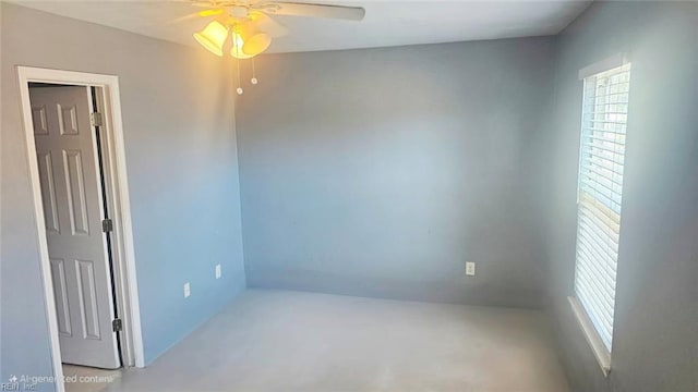 unfurnished room with a ceiling fan