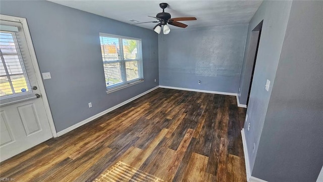 foyer featuring ceiling fan, baseboards, and wood finished floors