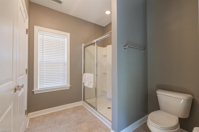 full bathroom with visible vents, a stall shower, toilet, and baseboards