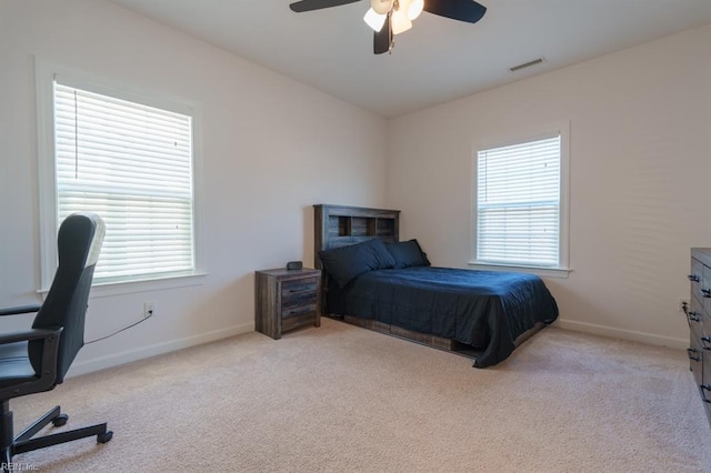 bedroom with carpet flooring, baseboards, and visible vents