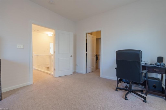 office with carpet flooring and baseboards