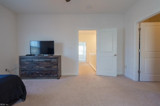 bedroom featuring baseboards and carpet floors