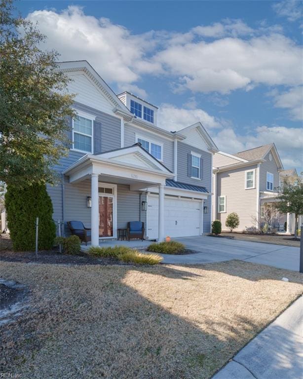 view of front facade featuring covered porch, concrete driveway, and a garage