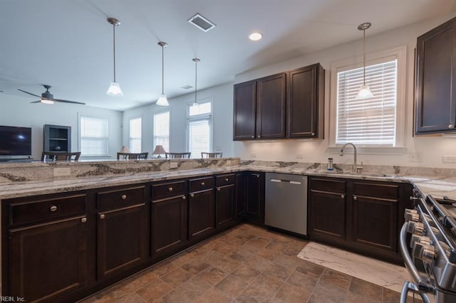 kitchen with dark brown cabinetry, light stone counters, visible vents, and appliances with stainless steel finishes