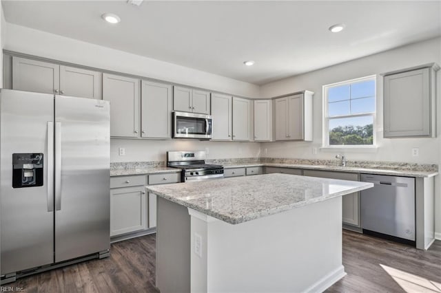 kitchen featuring dark wood-style floors, gray cabinets, and stainless steel appliances