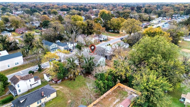 birds eye view of property with a residential view