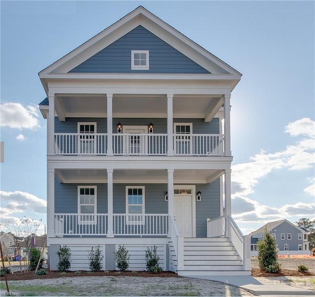 view of front facade featuring a balcony and a porch