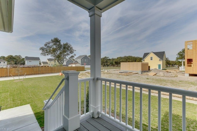 wooden terrace with a yard