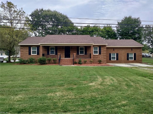 ranch-style house featuring a front lawn, brick siding, covered porch, and a shingled roof