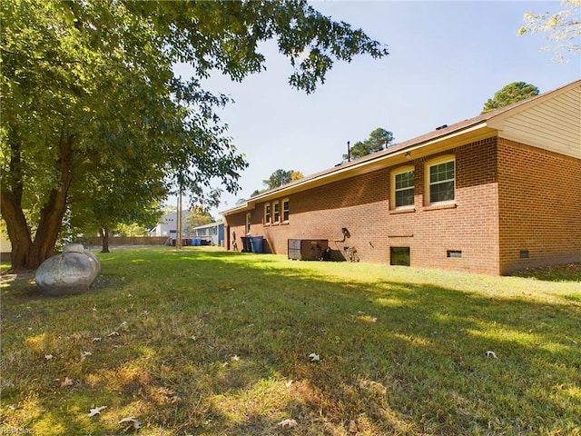 view of yard with central AC