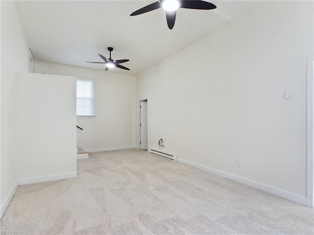 empty room featuring a baseboard heating unit, baseboards, and carpet