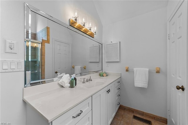 bathroom with visible vents, a shower stall, tile patterned flooring, baseboards, and vanity