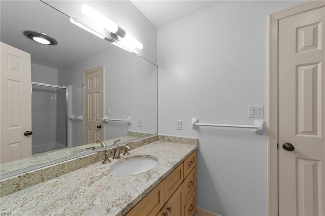 full bathroom featuring an enclosed shower and vanity