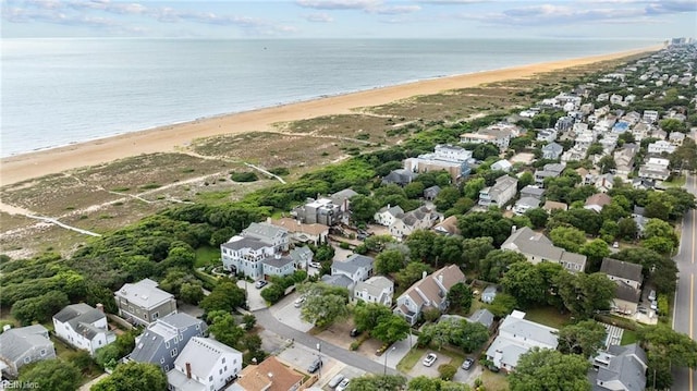 bird's eye view with a view of the beach, a water view, and a residential view