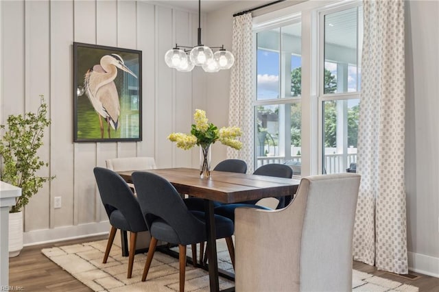 dining area with wood finished floors and baseboards