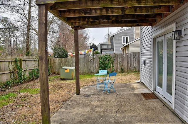 view of patio featuring fence