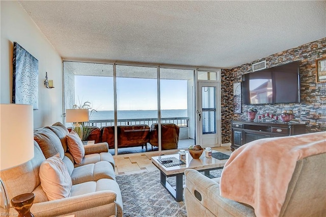 living area featuring a textured ceiling