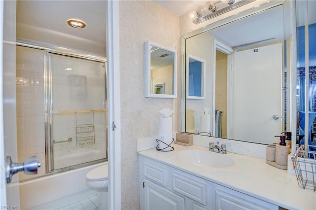 full bath featuring tile patterned floors, toilet, bath / shower combo with glass door, vanity, and a textured wall