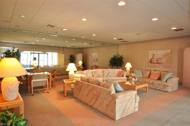 carpeted living area featuring recessed lighting, a paneled ceiling, and visible vents