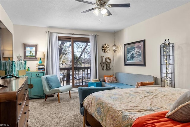 carpeted bedroom featuring a textured ceiling and access to exterior