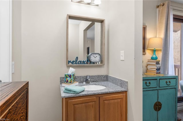 bathroom with a healthy amount of sunlight and vanity