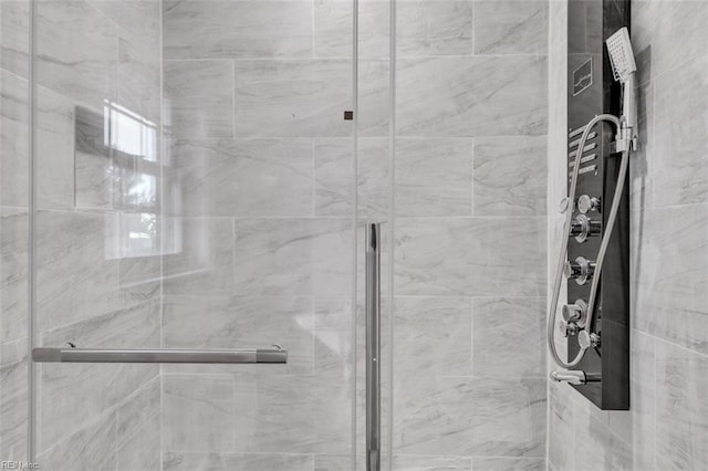 bathroom with a shower stall